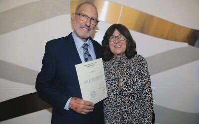 Rav Aron and Judy Amzalak with his smichah certificate. Photo: Elena Marguleva