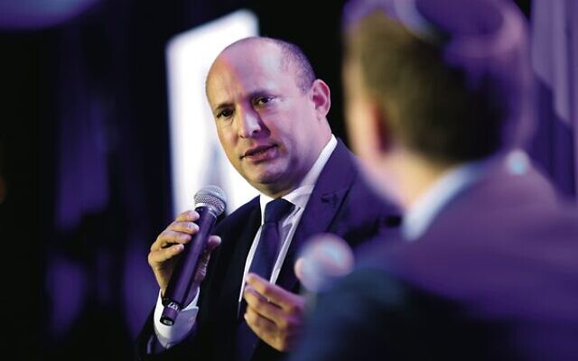 Former Israeli PM Naftali Bennett in conversation with Jeremy Leibler at the UIA gala event in Melbourne. 
Photo: Peter Haskin