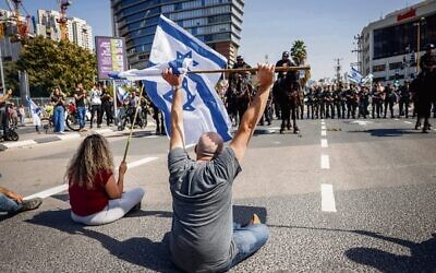Israelis block a road and clash with police as they protest against the government's planned judicial overhaul. Photo: Erik Marmor/Flash90