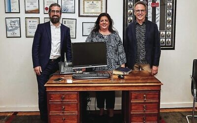 From left: Rabbi Yaakov Glasman, Janice Iloni-Furstenberg and Michael Bennett with Sir John Monash's desk. Photo: Paul Topol.