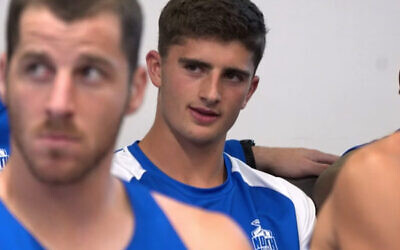 The moment Harry Sheezel found out he was in the Kangaroos starting side for round one of the 2023 AFL season at t team meeting on March 14. Photo: Screenshot of footage from North Melbourne Kangaroos