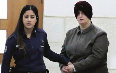 Malka Leifer (right) being brought to a courtroom in Jerusalem in 2018. Photo: AP Photo/Mahmoud Illean, File