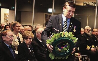 NSW Minister for Local Government Ron Hoenig lays a wreath. 
Photo: Shane Desiatnik