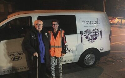 Father Bob with Ellen Frajman and TBI's Nourish van.