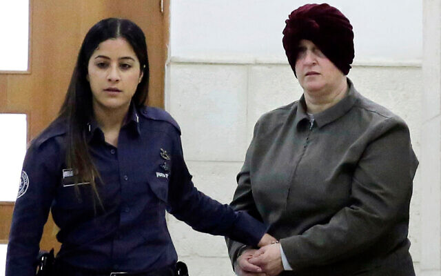 Malka Leifer, right, is brought to a courtroom in Jerusalem, on February 27, 2018. Photo: AP Photo/Mahmoud Illean, File