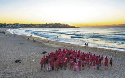 Remember the Yom volunteers, forming a pink triangle at sunrise at Bondi Beach on March 30. 
Photo: Airview Online, taken from a drone
