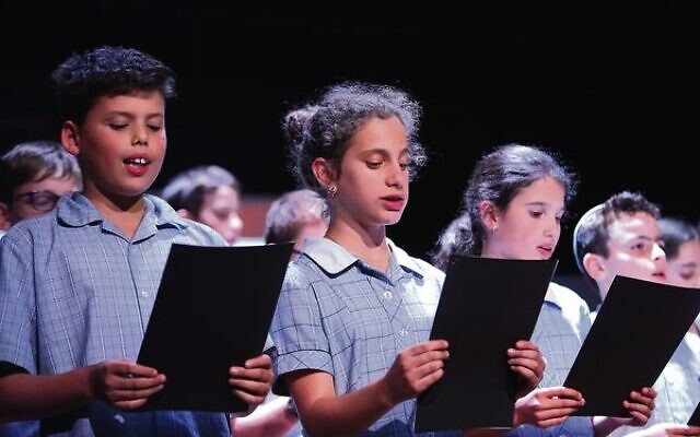 Year 5 and 6 students from Sholem Aleichem College sing the Partisan Song during the Yom Hashoah event at Glen Eira Town Hall. Photo: Peter Haskin