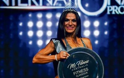 Martine Lewis in 2019 with her Ms Fitness Australia Pro Champion trophy. Photo: Nelson Azevedo