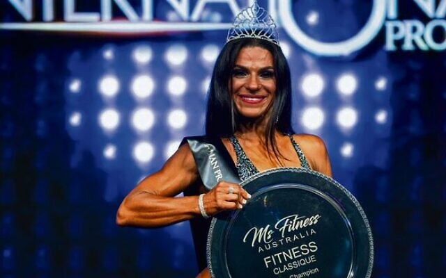 Martine Lewis in 2019 with her Ms Fitness Australia Pro Champion trophy. Photo: Nelson Azevedo