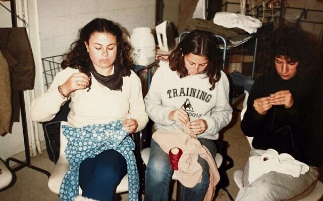 Deborah (left), mending clothes in the kibbutz laundry.