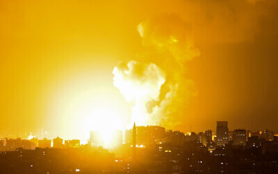 Smoke rises above buildings in Gaza City following an Israeli airstrike on May 2, 2023. Photo: Mohammed Abed/AFP