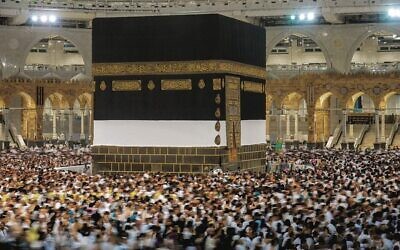 Muslim pilgrims walk around the Kaaba at the Grand Mosque in Mecca.  Photo: Amr Nabil/AP