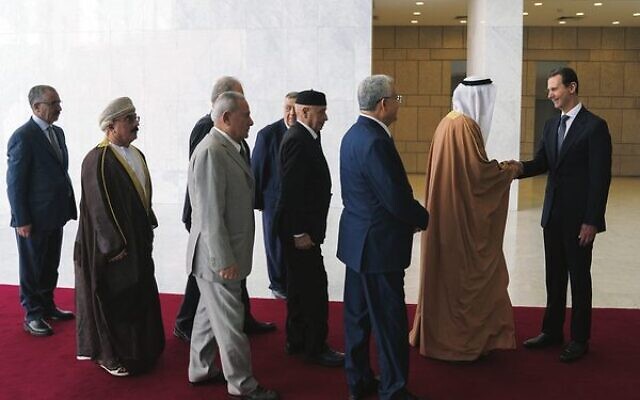 Syrian President Bashar Assad (right) receives a delegation representing various Arab parliaments in Damascus, February 26, 2023. Photo: SANA via AP