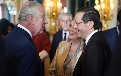 Britain's King Charles III, left, speaks with the President of Israel, Isaac Herzog and his wife Michal, during a reception at Buckingham Palace, in London, Friday May 5, 2023 for overseas guests attending his coronation. Photo: Jacob King/Pool Photo via AP