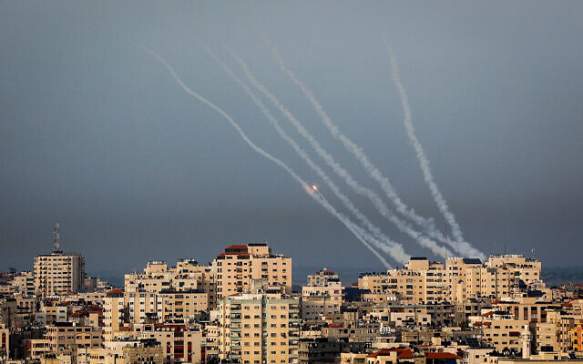 Trails of smoke are seen as rockets are fired from Gaza toward Israel on May 11, 2023. Photo: Atia Mohammed/Flash90