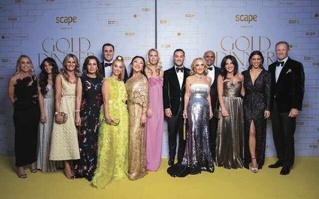 The Gold Dinner 2023 organising committee. Co-chairs Joshua and Linda Penn are pictured sixth and fifth from the right, and Benita Kam is third from the right.