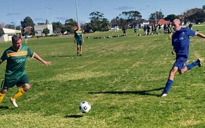 Maccabi over-45s player Geoff Sirmai (right) chases a loose ball against Maroubra last Sunday.