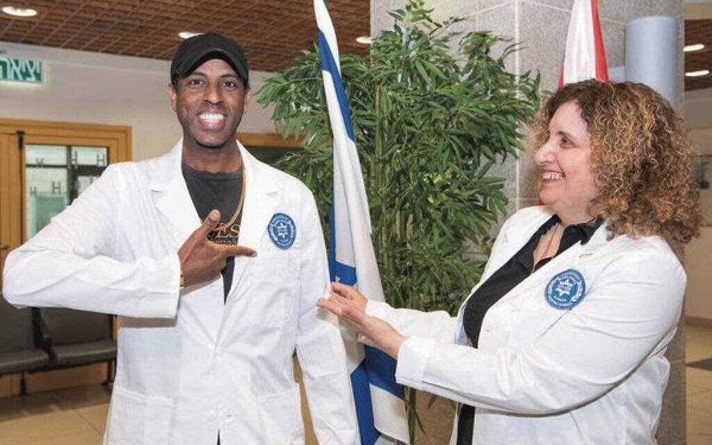 Ethiopian-Israeli wears white coat