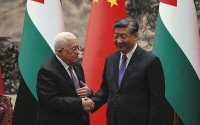 Mahmoud Abbas (left) shakes hands with China's President Xi Jinping in Beijing on June 14. 
Photo: Jade Gao/Pool/AFP