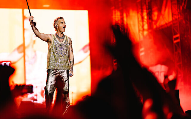 UK pop star Robbie Williams performs in Tel Aviv at Yarkon Park on June 1, 2023. Photo: Guy Sidi