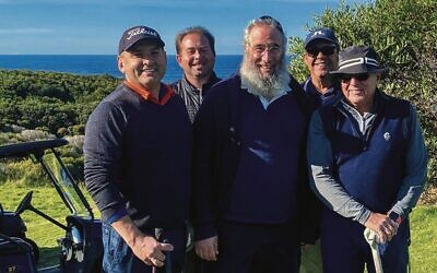 Rabbi Mendel Kastel (centre) with winning team members from Comlink, (from left) Paul Ghanem, John Ellis, Brad Armstrong, and Gary Cohen.