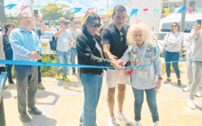 Ribbon cutters, from left: Hayley Southwick, Peter Horovitz and Esther Frenkiel.