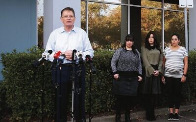 Former premier Ted Baillieu at a 2020 media conference with (from left) Dassi Erlich, Nicole Meyer and Elly Sapper, after Malka Leifer was pronounced fit to stand trial for extradition to Australia. 
Photo: Peter Haskin