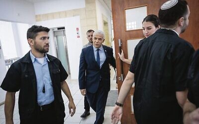 Opposition leader Yair Lapid arrives at the Jerusalem District Court to testify in Prime Minister Benjamin Netanyahu's trial. Photo: Yonatan Sindel/Flash90