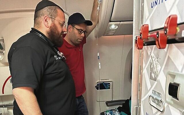 Hatzolah paramedics Mendy Litzman and David Platschek provided emergency medical assistance on a flight to Johannesburg.