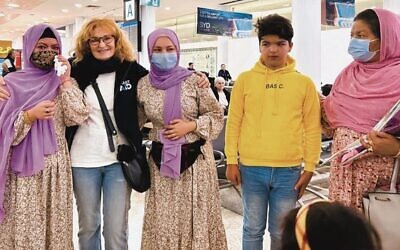 Alethea Gold (second from left) with (from left) Mida, Marges, Sami and their mother Freshta Hasanzadah, at Sydney Airport on June 27.