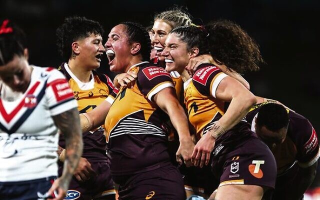 Ashleigh Werner (right) celebrates a Broncos try with her teammates. Photo: NRL Imagery