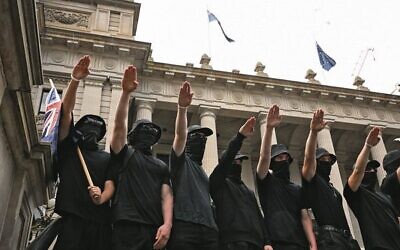 Neo-Nazis outside Parliament House in Melbourne on Saturday, March 18. Photo: AAP Image/James Ross