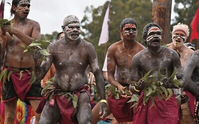 Members of the Yolngu people from north-eastern Arnhem Land perform the Bunggul traditional dance during the Garma Festival in northeast Arnhem Land, Northern Territory. Photo: AAP Image/Mick Tsikas