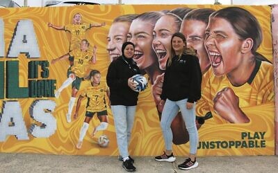 Deema Al-Rahmi (left) and Hadas Prawer pictured in front of the Matildas mural at Bondi Beach.