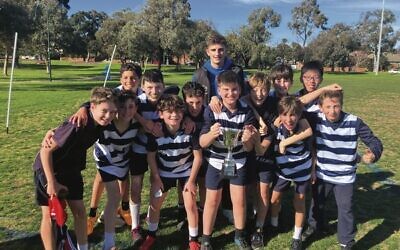 Harry Sheezel with the 
boys' winners of the 
2023 Jewish Schools Cup,
 The King David School.