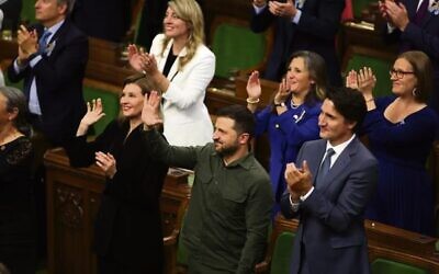 Volodymyr Zelensky and Justin Trudeau join the standing ovation. 
Photo: Patrick Doyle/The Canadian Press via AP