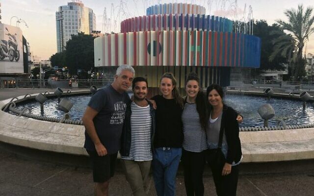 Lani with her husband and children in Dizengoff Square.