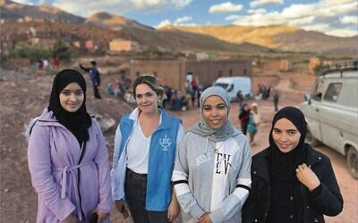 A JDC aid worker (second from left) with Moroccan women in the earthquake disaster zone.