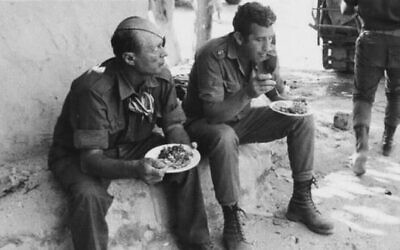 Defence Minister Moshe Dayan (left) visits the Suez Canal ahead of or during the Yom Kippur War, October 1973. Photo: Israeli State Archives