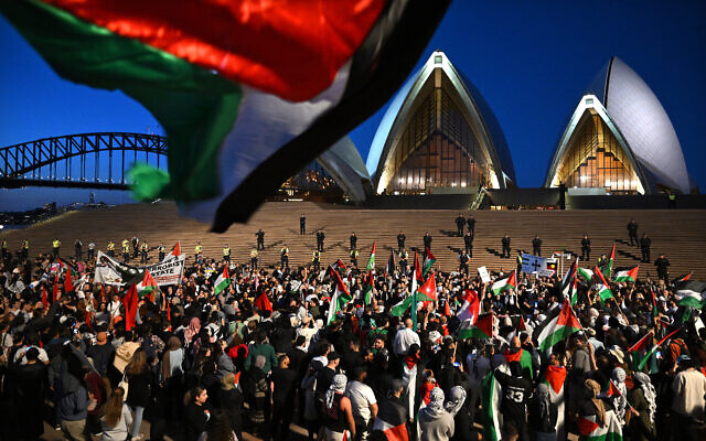 Participants of a Free Palestine rally react outside the Sydney Opera House in Sydney, Monday, October 9, 2023. Photo: AAP Image/Dean Lewins