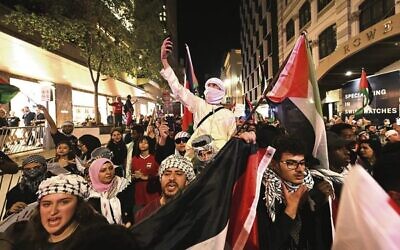 Pro-Palestinian demonstrators in Brisbane last Friday, October 13. 
Photo: AAP Image/Darren England