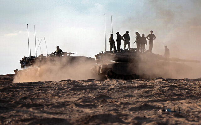 Israeli troops and tanks gather in a field near Kibbutz Be'eri in southern Israel on October 14, 2023. Photo: Thomas COEX/ AFP/The Times of Israel.