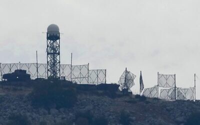 The fence of an Israeli military position is seen damaged after Hezbollah targeted it by rockets on the Lebanese border on October 8. Photo: AP Photo/Hussein Malla