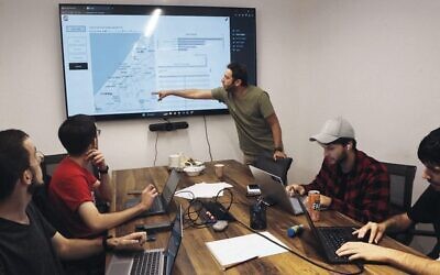 Volunteers at the offices of Gitam BBDO in Tel Aviv on October 25. 
Photo: Gil Cohen-Magen/AFP