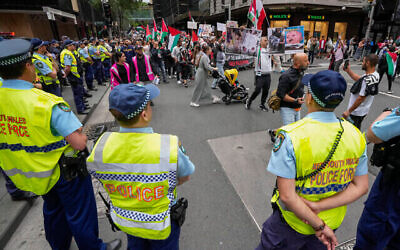 Police watch as protesters march during a pro-Palestinian rally in Sydney, Australia, Saturday, Nov. 4, 2023. (The Times of Israel: AP/Mark Baker)