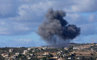 Illustrative: Black smoke rises from an Israeli airstrike on the outskirts of Aita al-Shaab, a Lebanese border village with Israel, as it is seen from Rmeish village in south Lebanon, Tuesday, Nov. 21, 2023 (The Times of Israel: AP Photo/Hussein Malla)