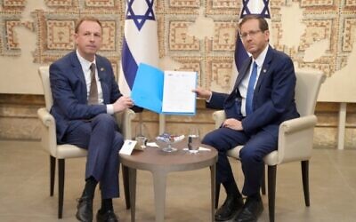 ZFA president Jeremy Leibler (left) presents the signed letter to Israeli President Isaac Herzog. Photo: Supplied