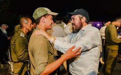 Rabbi Eli Schlanger (right) with an IDF soldier. Photo: Supplied