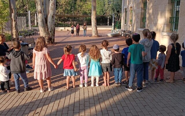 Teens play with children in Jerusalem during the weeks after Hamas' Oct. 7, 2023, attack on Israel. Photo: Odelia Kaye