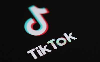 Logo of the social network application Tik Tok on the screen of a phone. Photo: Martin Bureau/AFP via Getty Images